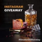 Instagram Giveaway Promotional Piece Featuring Pomegranate, Orange and Bourbon Cocktail with Old Fashioned Decanter