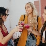 Women Cheers with Snake Oil Cocktails